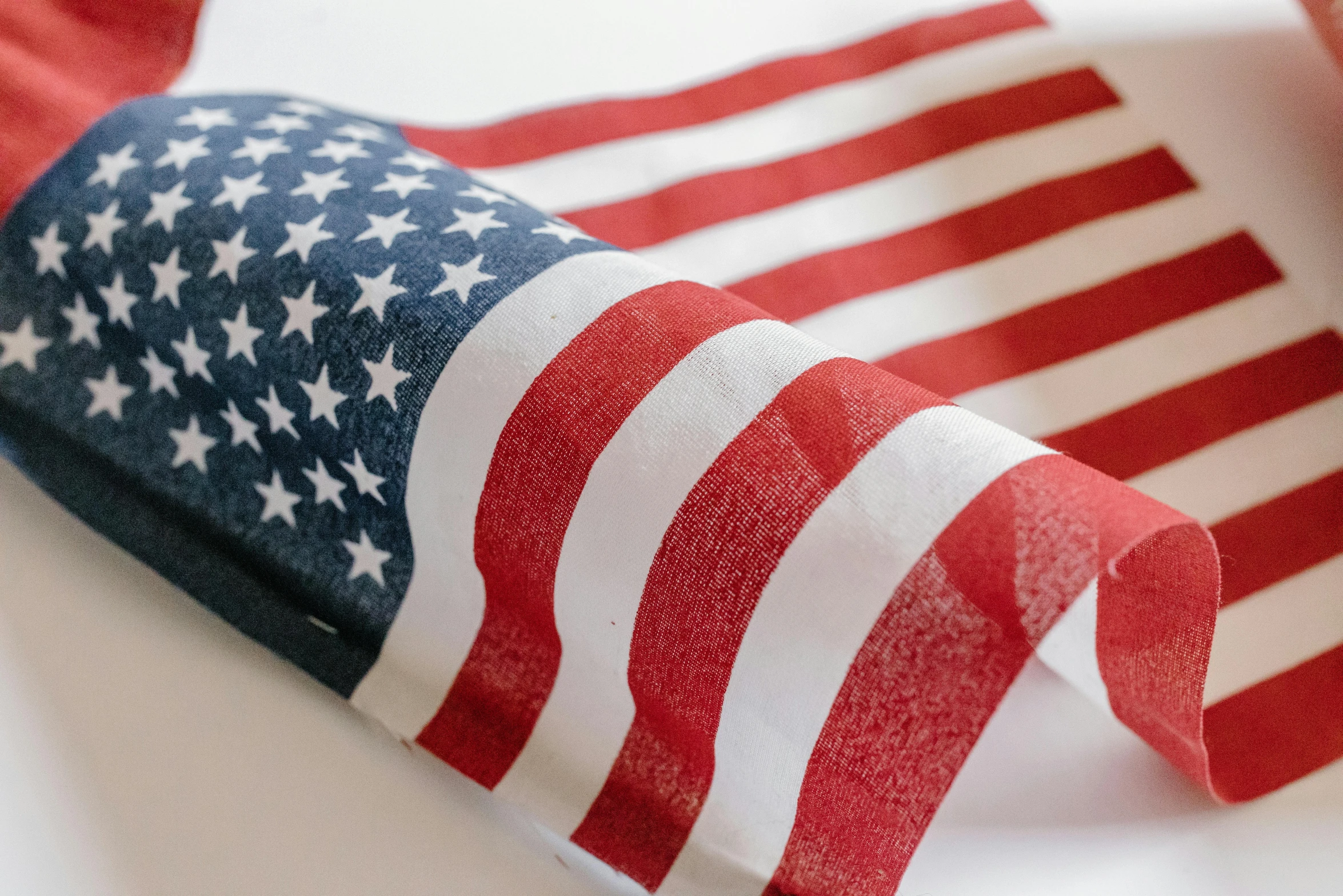 a close up of an american flag on a table, profile image