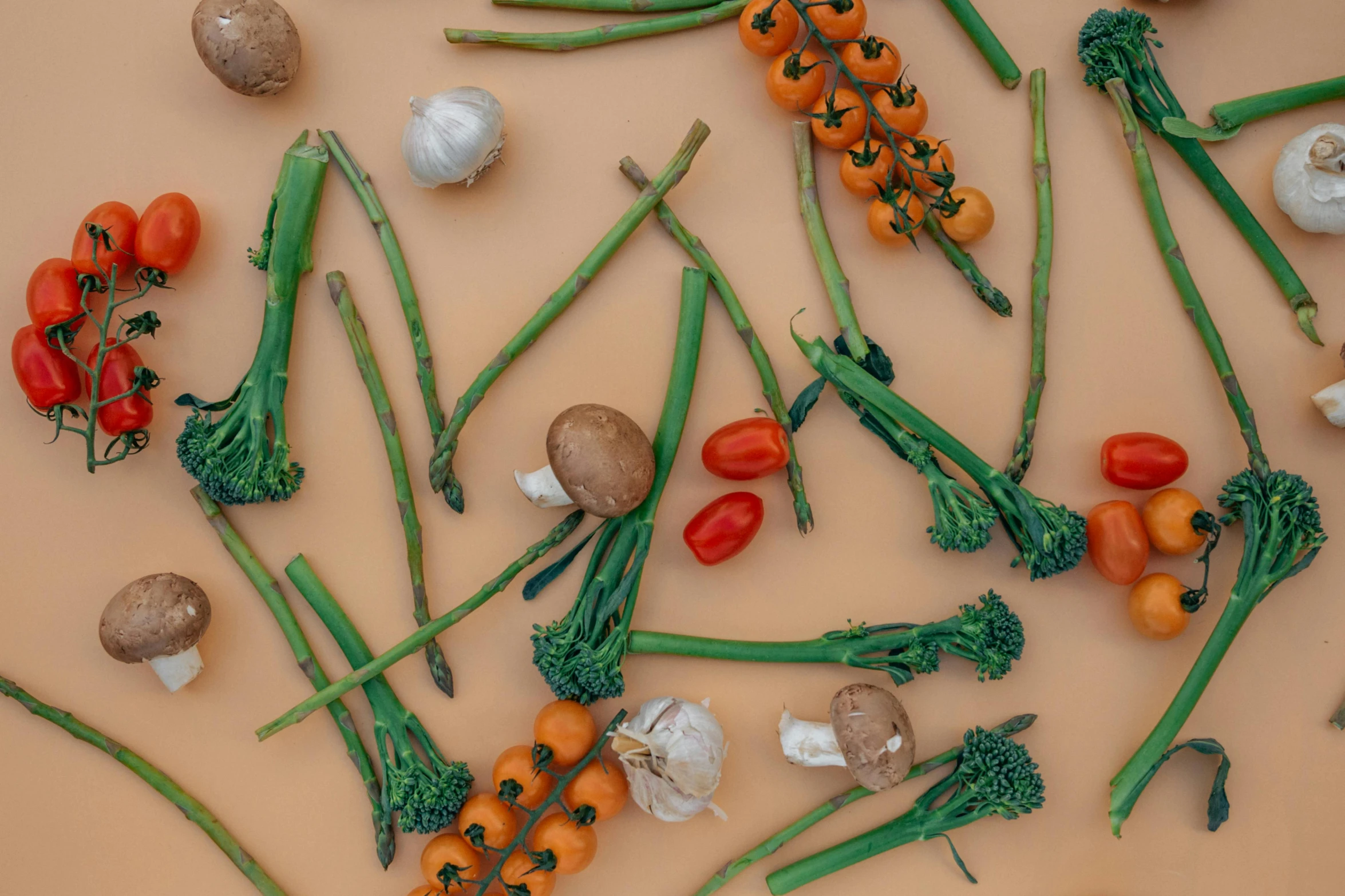 a table topped with lots of different types of vegetables, by Carey Morris, pexels contest winner, in front of an orange background, organic lines, stick and poke, high angle close up shot