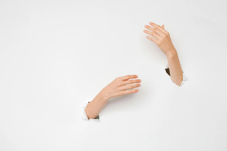 a person reaching out of a hole in a wall, trending on pexels, hyperrealism, white background, two arms, cardboard, ( ultra realistic