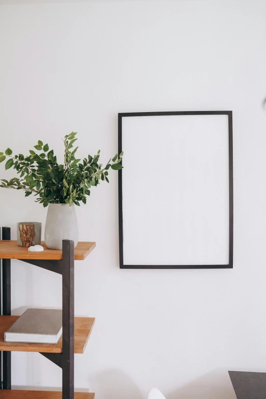 a picture frame hanging on a wall in a living room, trending on unsplash, postminimalism, iron frame, on a white table, corners, large tall