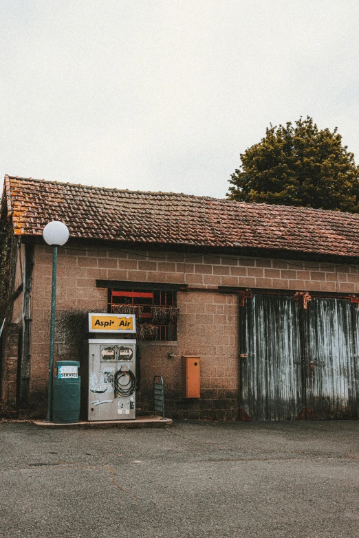 a red fire hydrant sitting in front of a brick building, by Andries Stock, pexels contest winner, next to a farm house and a barn, inside a gas station, old man, vending machine