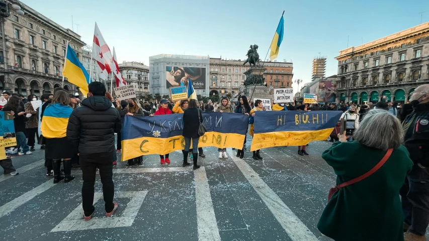 a group of people that are standing in the street, antipodeans, ukrainian flag on the left side, thumbnail, placards, square