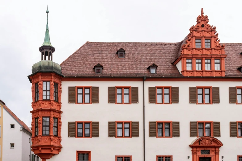 a red and white building with a clock tower, inspired by Matthias Jung, pexels contest winner, heidelberg school, copper details, panorama, private school, nice slight overcast weather