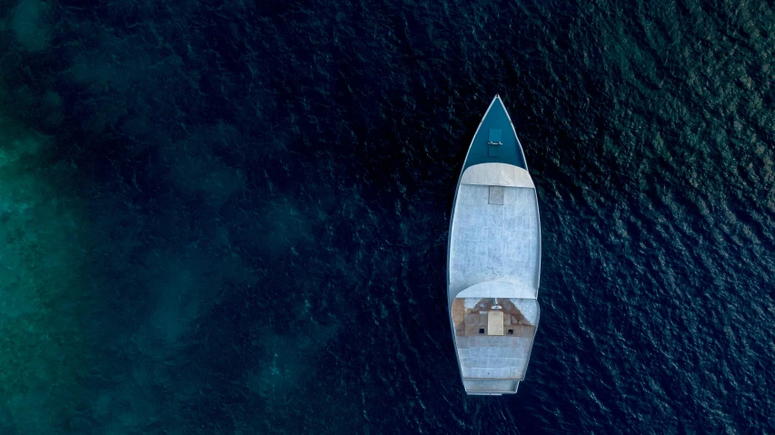 a small boat in the middle of a body of water, a digital rendering, pexels contest winner, birdseye view, hiroshi sugimoto, on the bow, cerulean