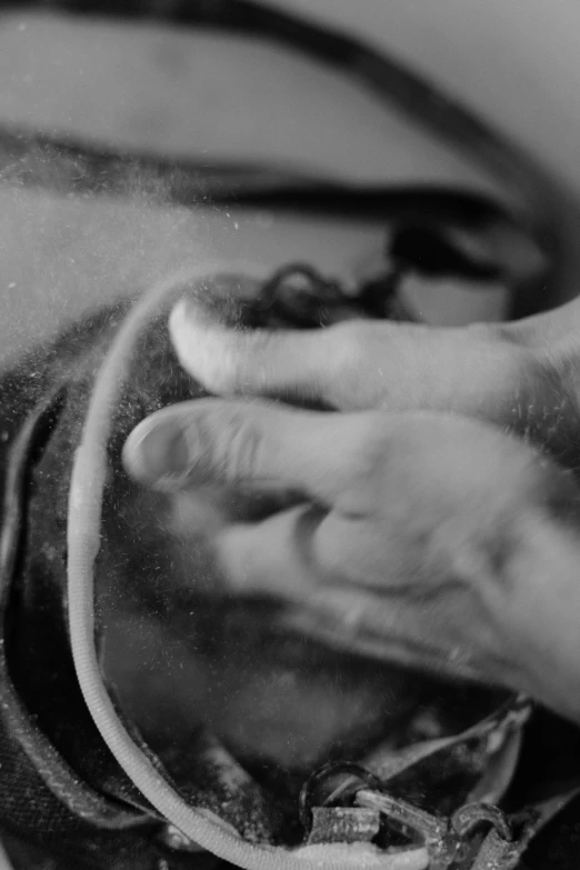 a black and white photo of a person washing their hands, inspired by Roy DeCarava, process art, close-up fight, dust mask, boxing, video still