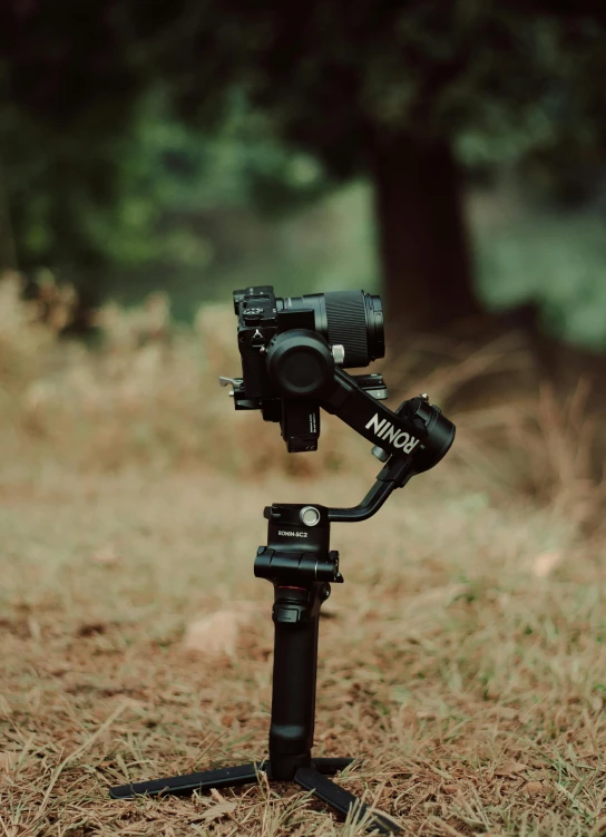 a close up of a camera on a tripod, looking towards the camera, high quality product image”, camera on the ground, high quality photo