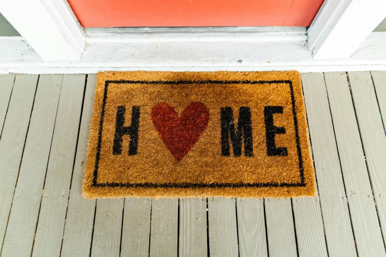 a door mat that says home with a heart on it, an album cover, pexels, square, frank moth, new hampshire, lgbtq