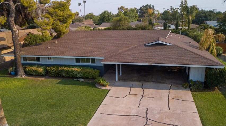 a house sitting on top of a lush green field, a portrait, featured on reddit, 1600 south azusa avenue, top down angle, high quality photo, paved