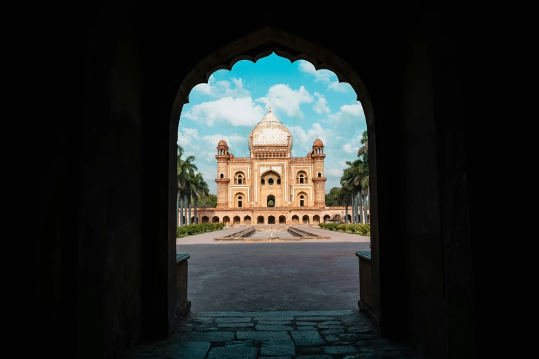 a view of a building through an archway, an album cover, by Bernardino Mei, unsplash contest winner, india, tomb, college, summer day