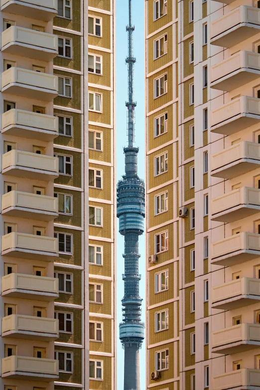 a tall tower towering over a city filled with tall buildings, by Konrad Witz, unsplash contest winner, modernism, soviet apartment buildings, slovakia, focus stacking, very ornamented