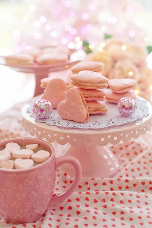 a table topped with plates of cookies and cups of coffee, romanticism, pink hearts in the background, brightly lit pink room, peach, marshmallow graham cracker