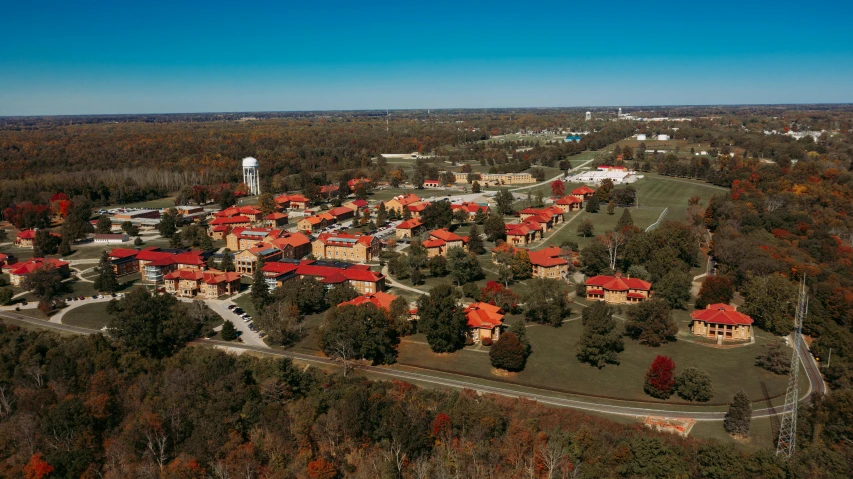 an aerial view of a campus surrounded by trees, by Joe Stefanelli, renaissance, oklahoma, barracks, slide show, the panorama