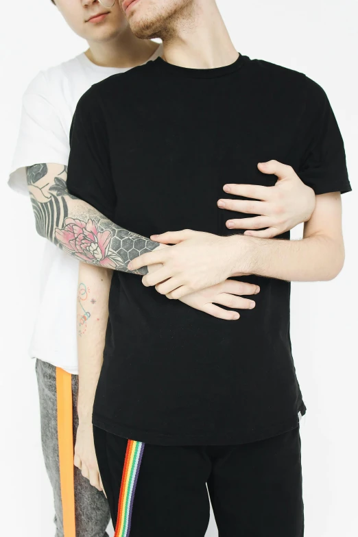 a man and a woman standing next to each other, a tattoo, trending on unsplash, antipodeans, lesbian embrace, a black tshirt. high key, male ulzzang, brothers