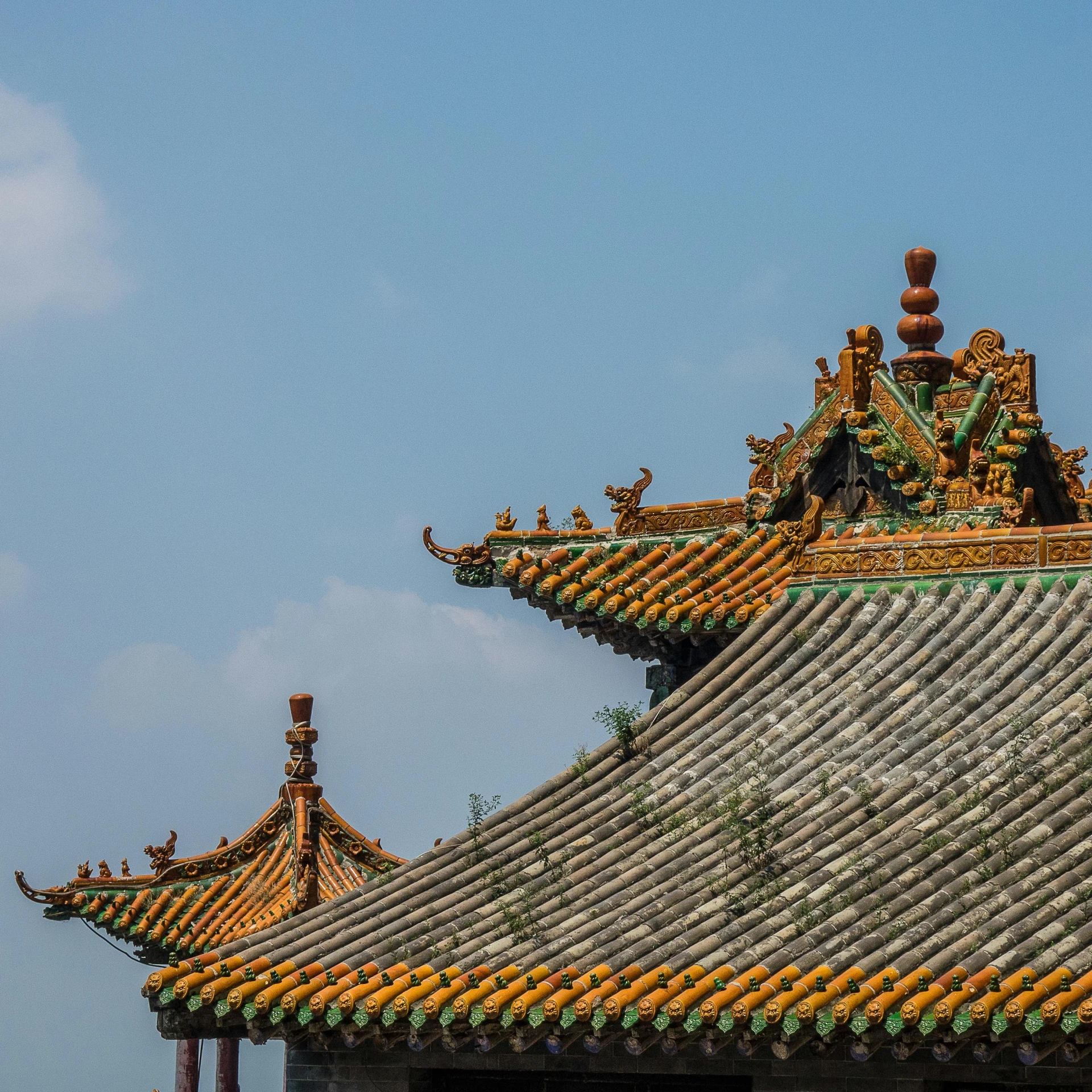 a building with a clock on top of it, inspired by An Zhengwen, trending on unsplash, cloisonnism, simple gable roofs, baotou china, tent architecture, spines and towers