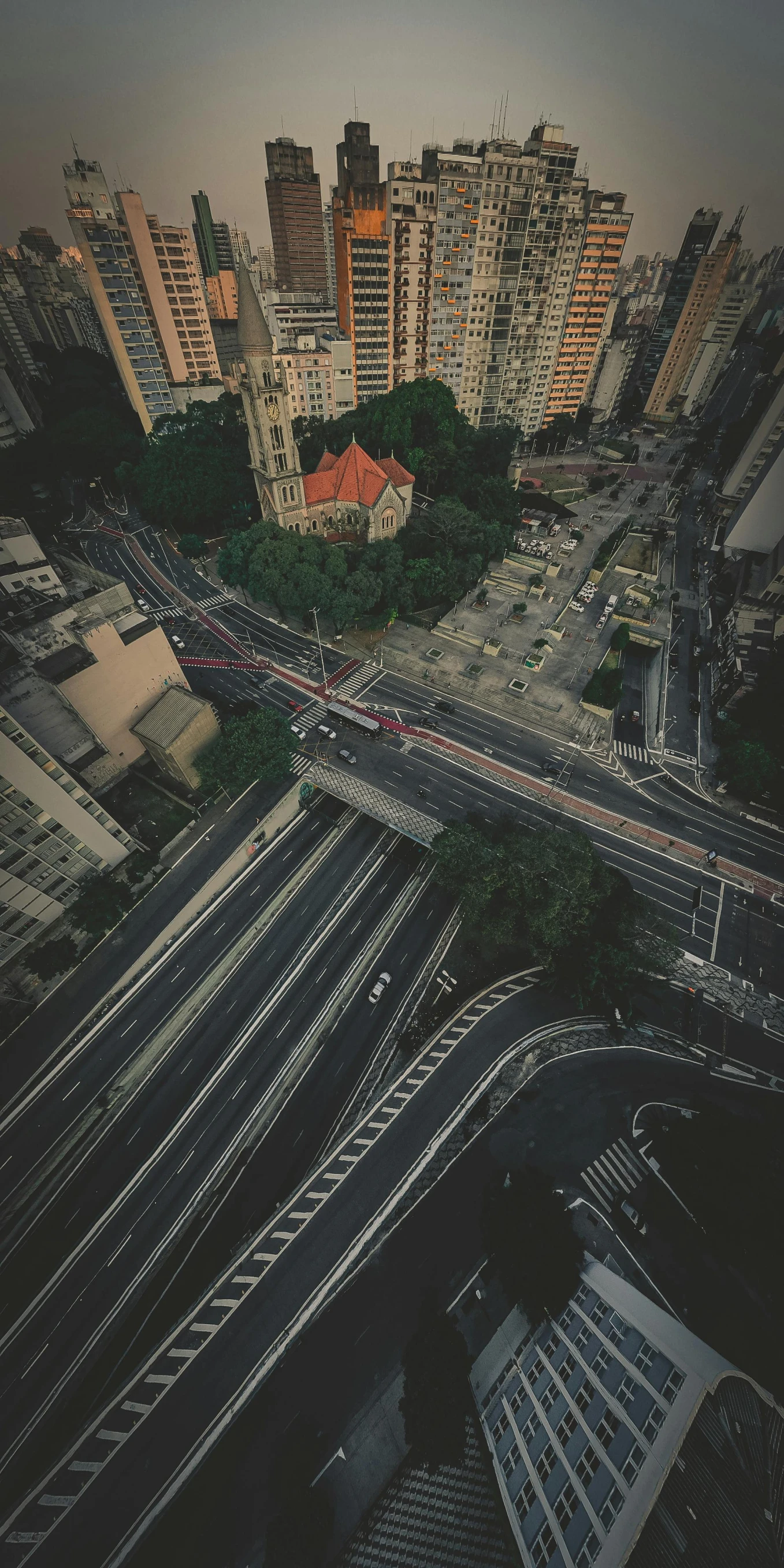 a city filled with lots of tall buildings, an album cover, unsplash contest winner, accurate roads, overpass, low quality photo, square