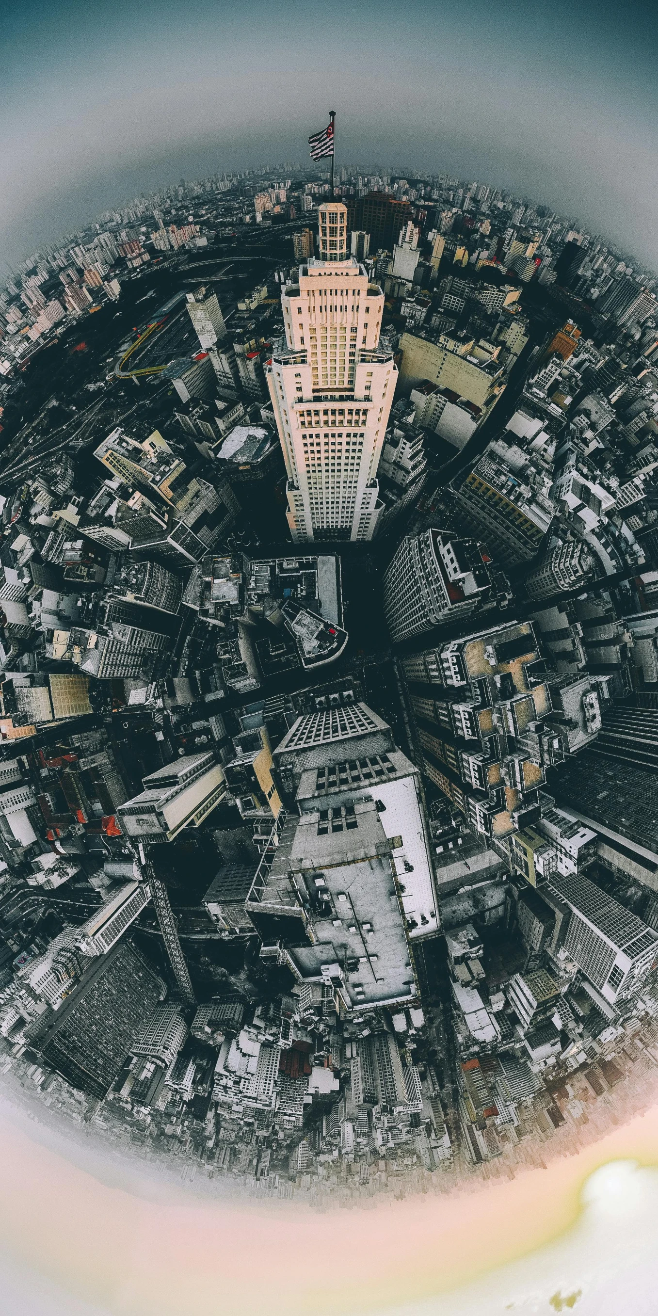 a view of a city from the top of a building, looking up at camera, high complexity, instagram post, deeply hyperdetailed