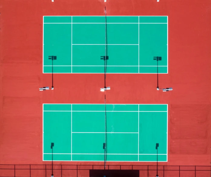 a couple of tennis courts sitting next to each other, an album cover, inspired by Hans Mertens, pexels contest winner, postminimalism, drone photograpghy, badminton, red green color palette, knolling