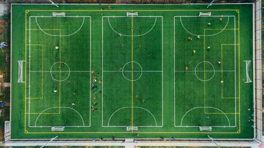 an aerial view of a soccer field, by Carey Morris, unsplash contest winner, conceptual art, rectangle, turf roof, group photo, helicopter view