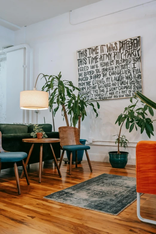 a living room filled with furniture and plants, by Jessie Algie, trending on unsplash, waiting room, designer art, long shot from back, nyc