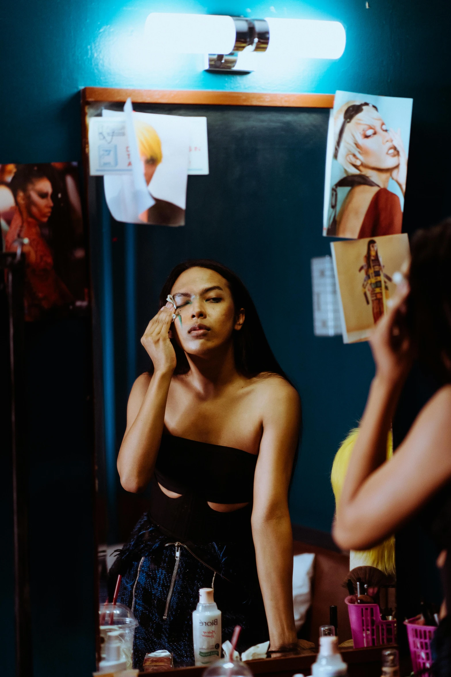 a woman standing in front of a mirror talking on a cell phone, a photo, trending on pexels, visual art, tessa thompson inspired, supermodel, putting makeup on, center of image