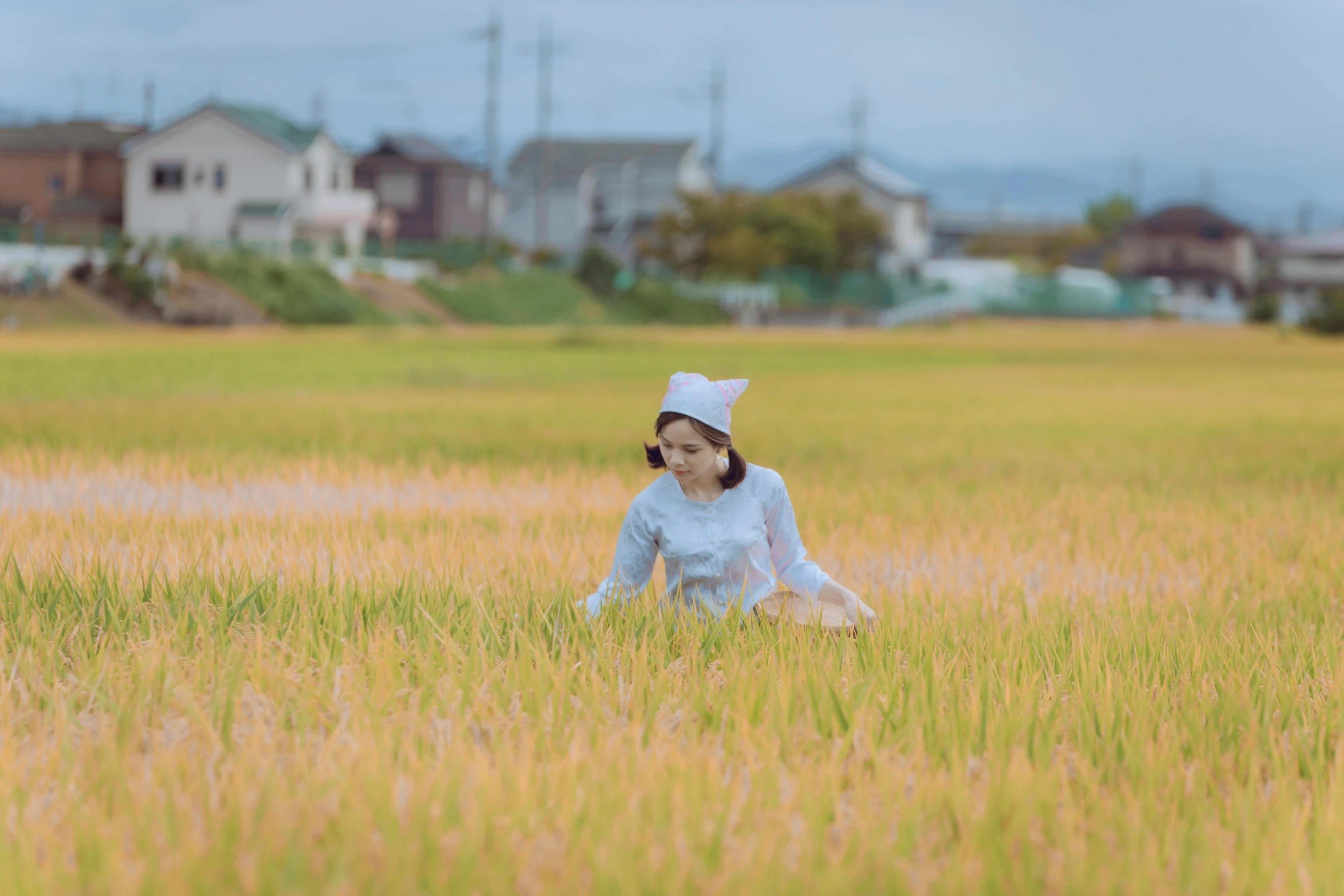 a woman standing in a field of tall grass, by Sengai, unsplash, japanese rural town, 8 k ), rice, outside on the ground