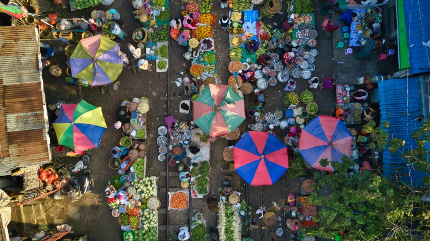 a market filled with lots of colorful umbrellas, pexels contest winner, wide aerial shot, square, indonesia, fruit