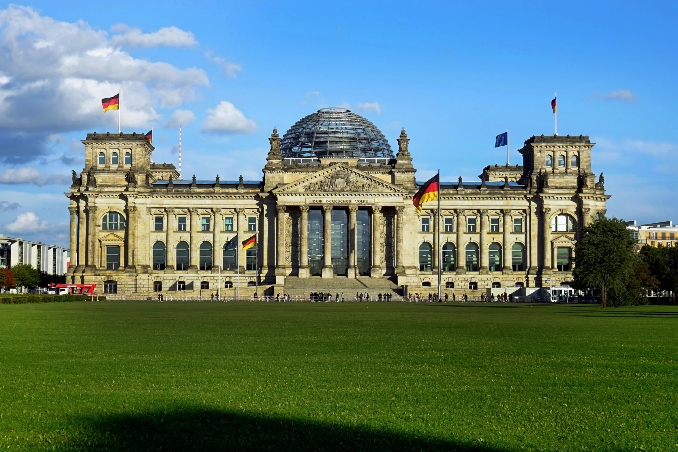 a large building sitting on top of a lush green field, pexels contest winner, berlin secession, parliament, 🚿🗝📝, profile image, german chancellor