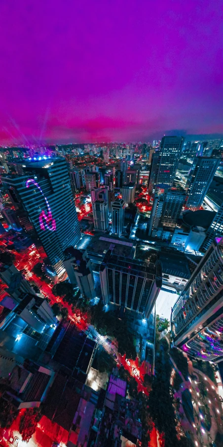 an aerial view of a city at night, an album cover, pexels contest winner, maximalism, sao paulo in the year 2 0 7 0, pink and blue lighting, hdr photography, purple and red colors