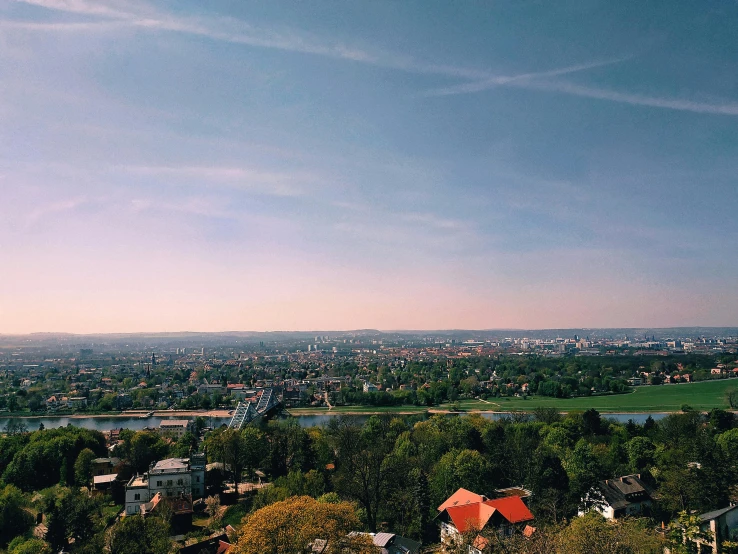 a view of a city from the top of a hill, by Emma Andijewska, sunny day time, esthetic photo, instagram photo, zdzislaw