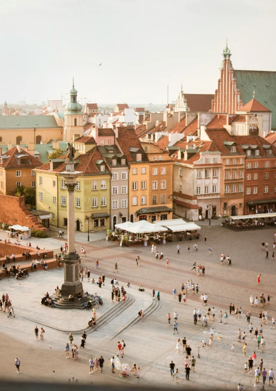 a crowd of people walking around a town square, inspired by Walenty Wańkowicz, unsplash contest winner, renaissance, city in background, daniel libeskind, polish, high-angle