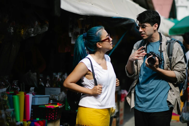 a man and a woman standing next to each other, pexels contest winner, chungking express color palette, taking a picture, shady, ariel perez