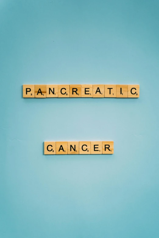 wooden scrabbles spelling pancreatic cancer on a blue background, an album cover, trending on pexels, panfuturism, office ceiling panels, panorama, tan, anaesthetic