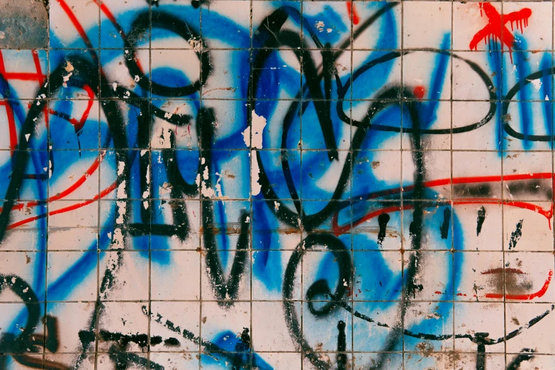 a wall covered in lots of graffiti next to a fire hydrant, pexels, background image, squares, ((blue)), blue and red