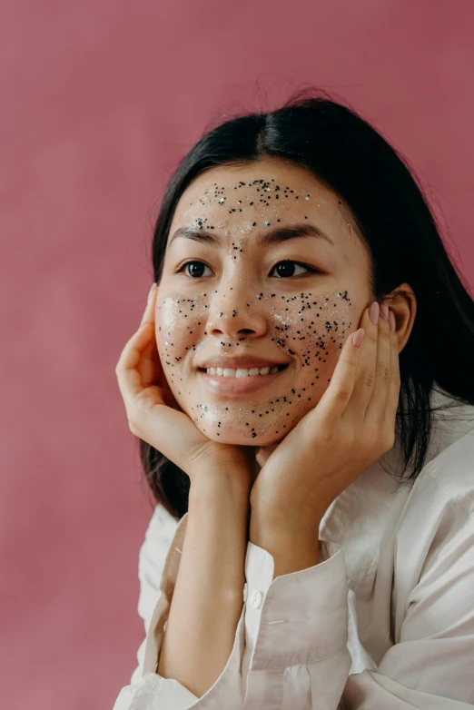 a woman with black spots on her face, a stipple, trending on pexels, mingei, happy girl, asian, face and body, with stars