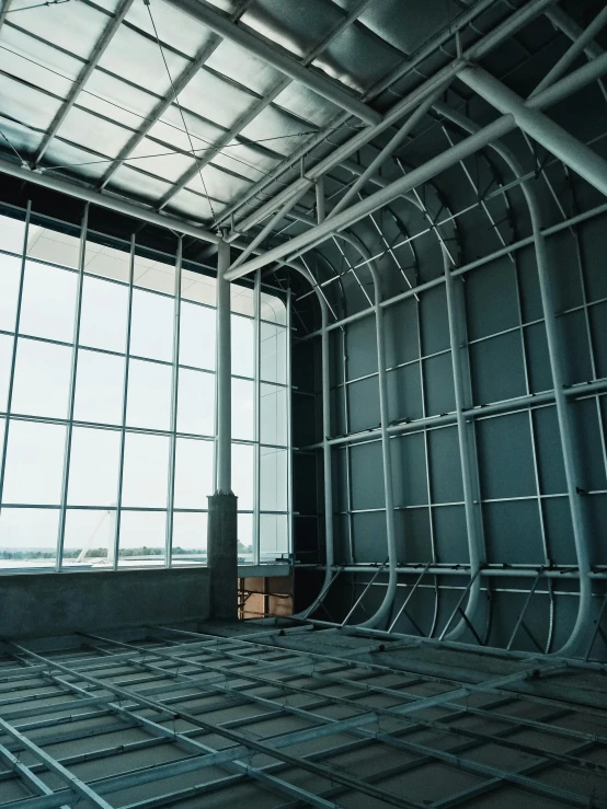 a large room filled with lots of metal pipes, unsplash, modernism, spaceship window, in future airport rooftop, footage of a theater stage, promo image