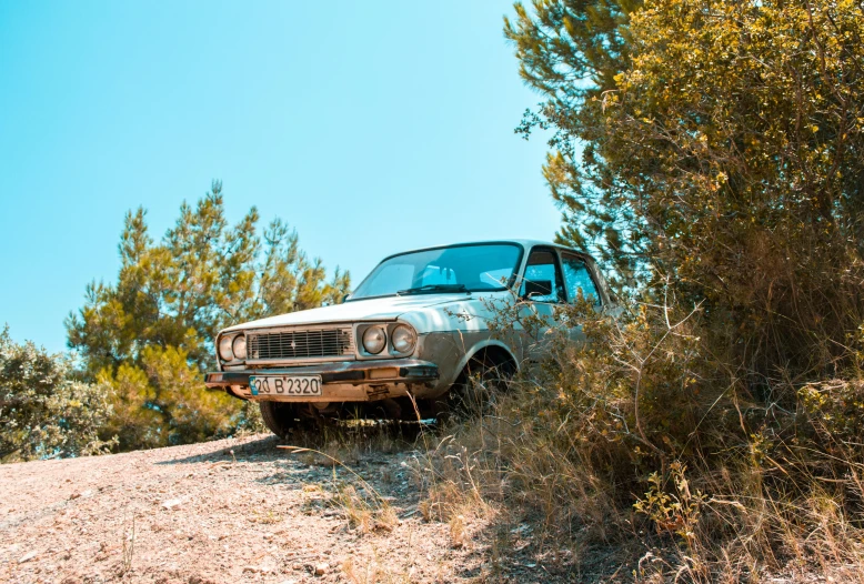 a car that is sitting in the dirt, a picture, by Thomas Häfner, pexels contest winner, romanticism, costa blanca, moskvich, on the mountain, avatar image