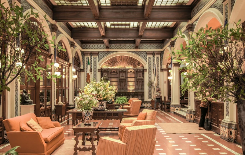 a living room filled with lots of furniture, inspired by Frederick Goodall, art nouveau, archways made of lush greenery, mexico city, grand library, thumbnail