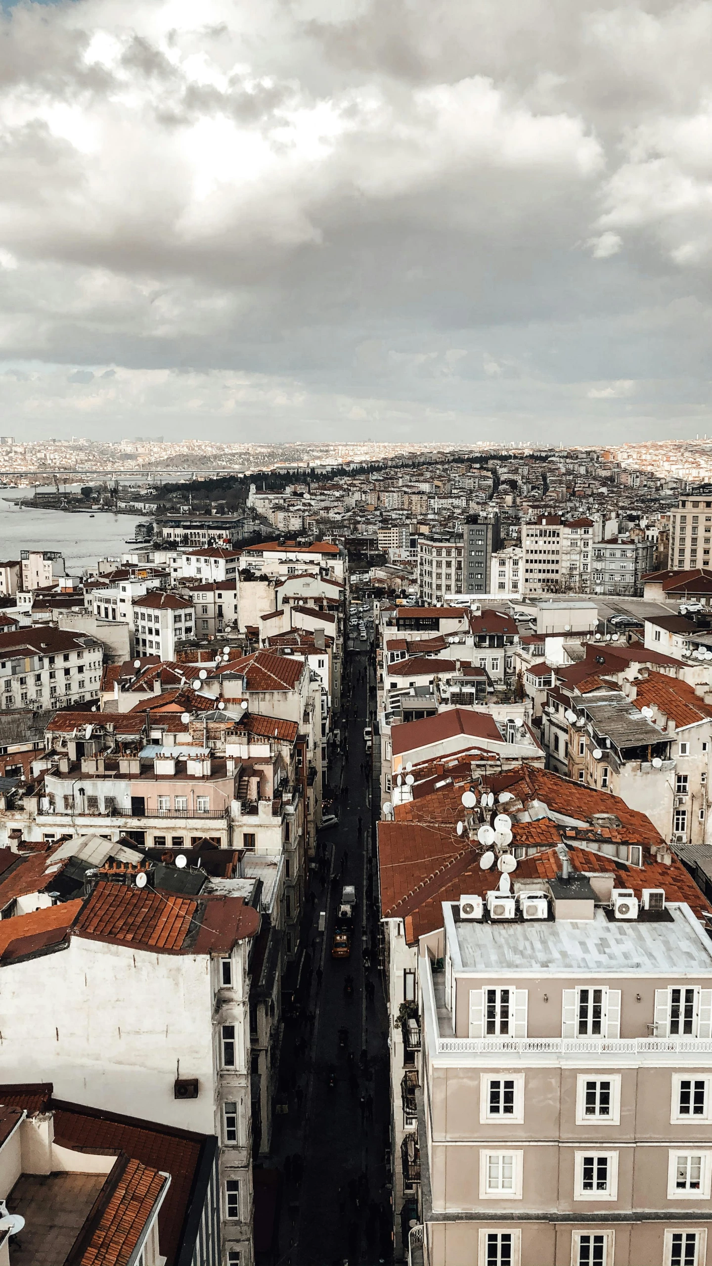 a view of a city from the top of a building, a colorized photo, by Cafer Bater, pexels contest winner, turkey, grey, slide show, flat lay