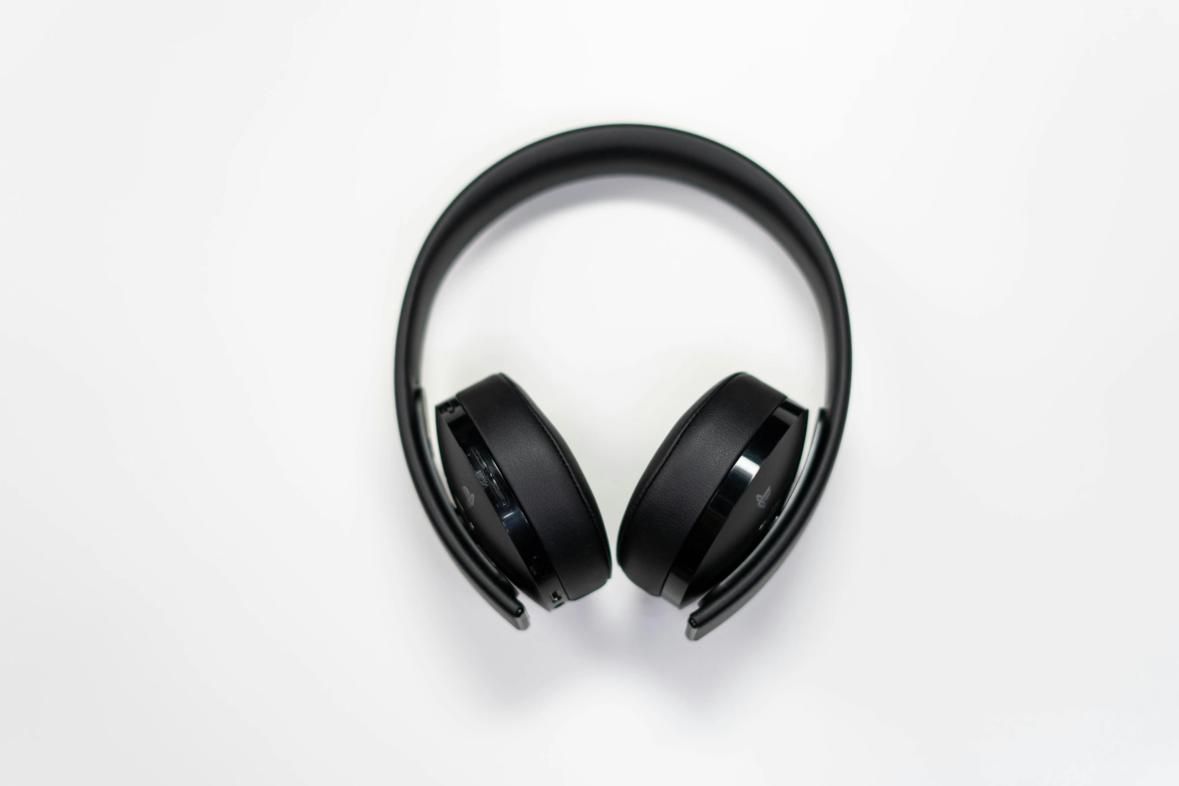 a pair of black headphones on a white surface, by Carey Morris, pexels, playstation 5, avatar image, leaked, 🦩🪐🐞👩🏻🦳