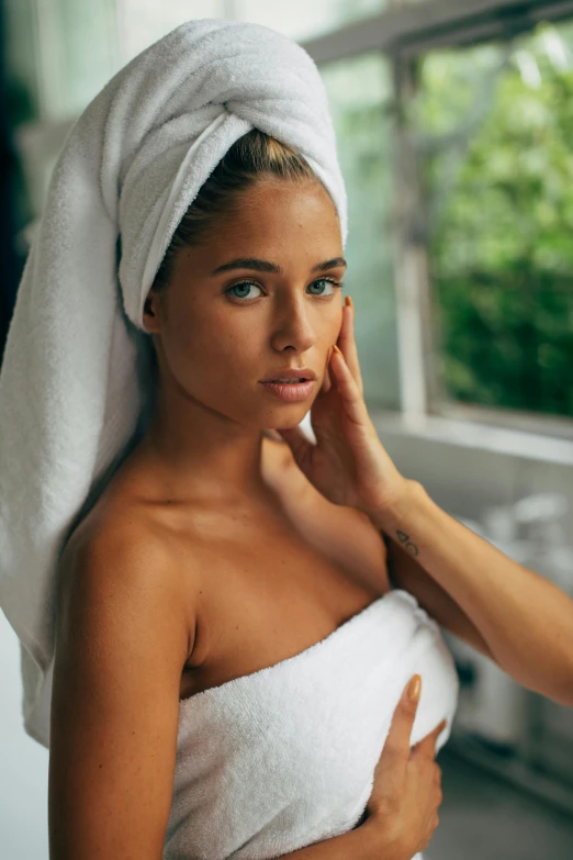 a woman with a towel wrapped around her head, deep tan skin, flawless features, super smooth, morning glow