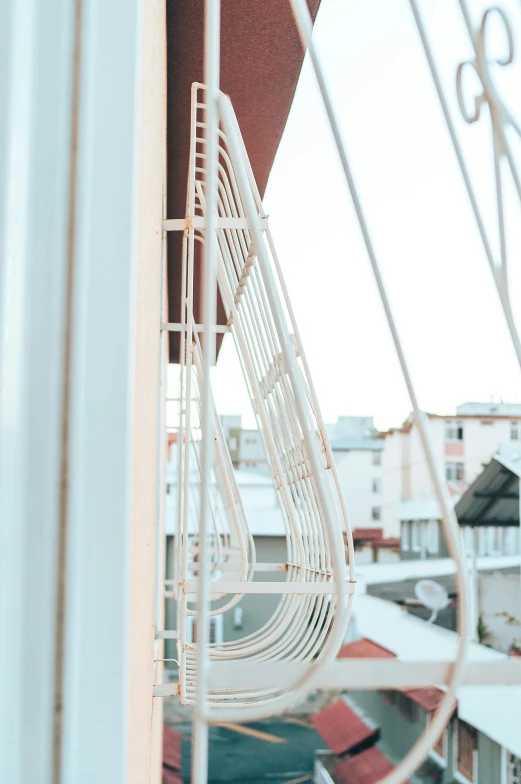 a view of a city from a balcony, an abstract sculpture, by Alexander Fedosav, unsplash, art nouveau, detail structure, white, view from side, featuring rhodium wires