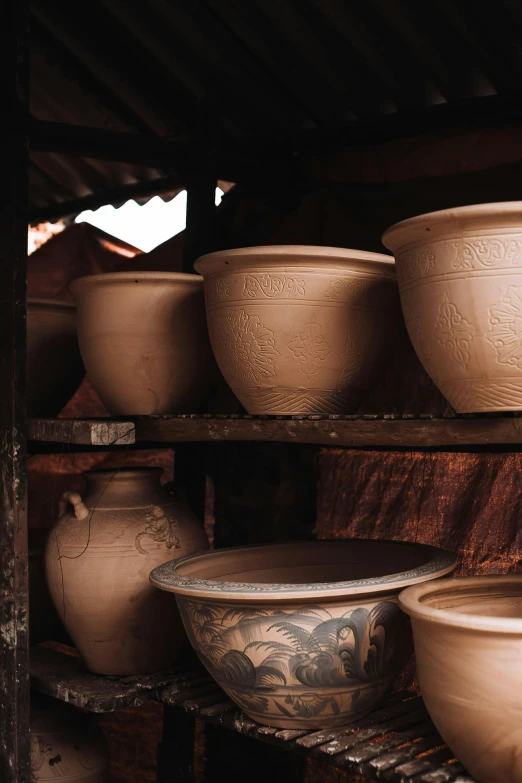 a bunch of pots that are on a shelf, intricate lining, in a workshop, phong shaded, exterior