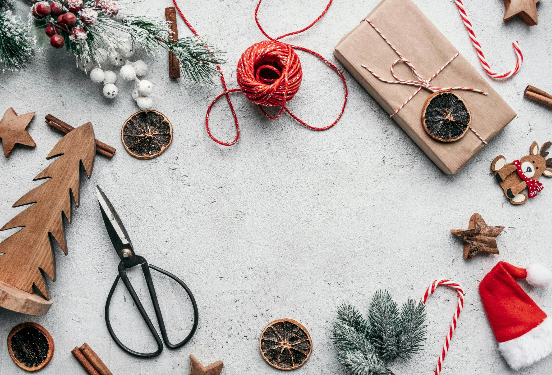 a table topped with christmas decorations and a pair of scissors, pexels contest winner, arbeitsrat für kunst, background image, 000 — википедия, dried herbs, gifts