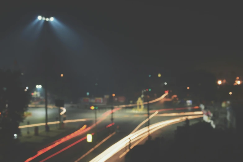 a city street filled with lots of traffic at night, pexels contest winner, realism, dreamy hazy, time exposure, streetlight, ilustration