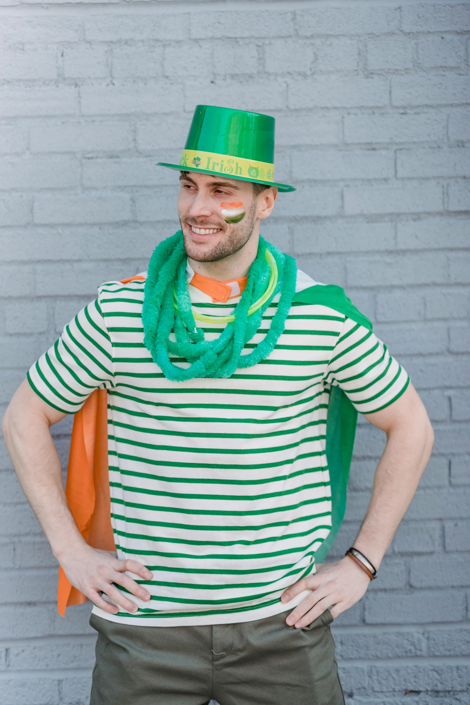 a man wearing a green hat and green scarf, inspired by Patrick Adam, reddit, wearing stripe shirt, streamers, jock, promo image