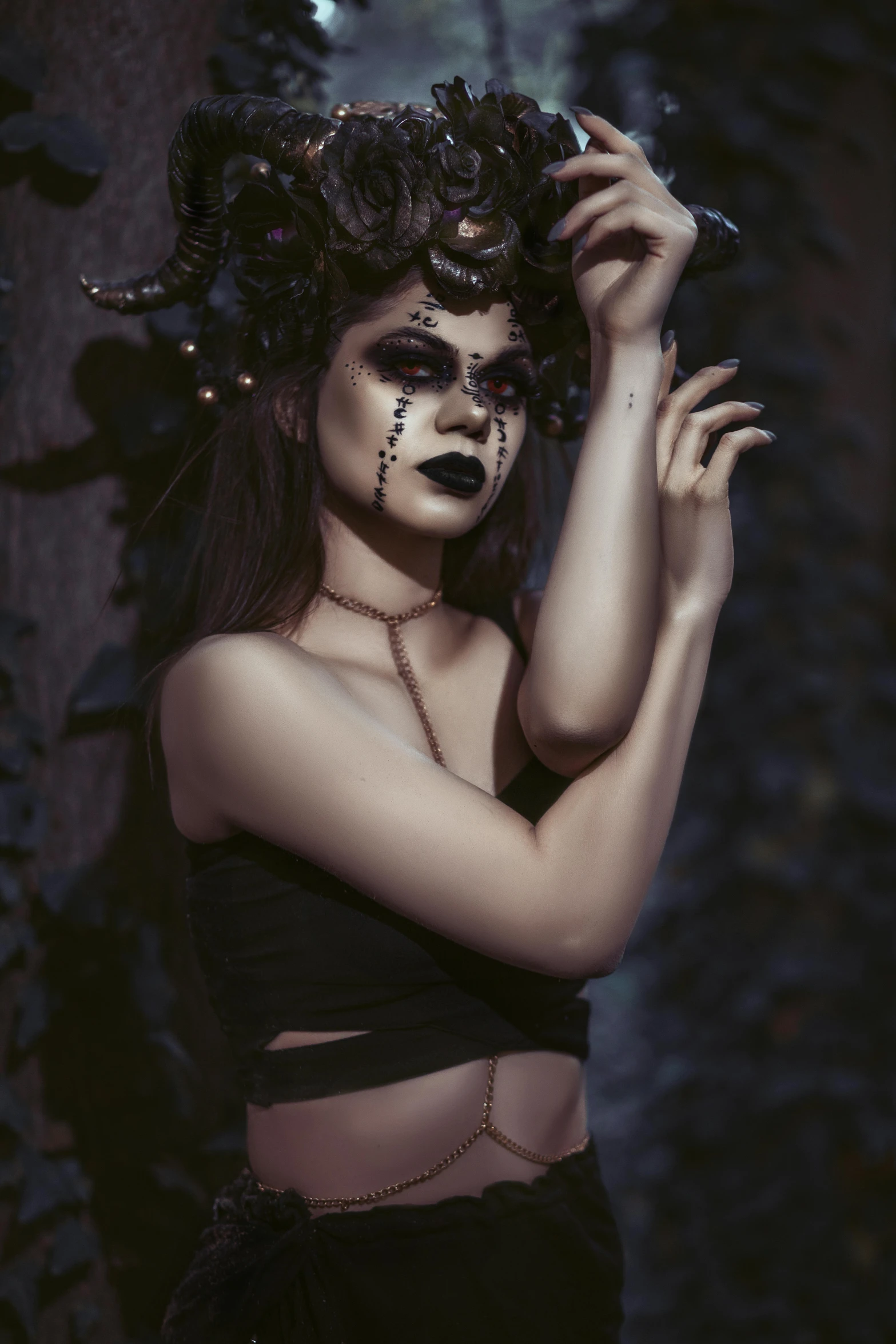 a woman in a black dress is posing with her hands on her head, inspired by Brom, pexels contest winner, gothic art, a horned, deviantart artstation cgscosiety, with black vines, a dark