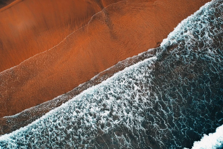 a person riding a surfboard on top of a sandy beach, unsplash contest winner, analytical art, red lava rivers, bird\'s eye view, 8 k resolution hyperdetailed, chocolate river