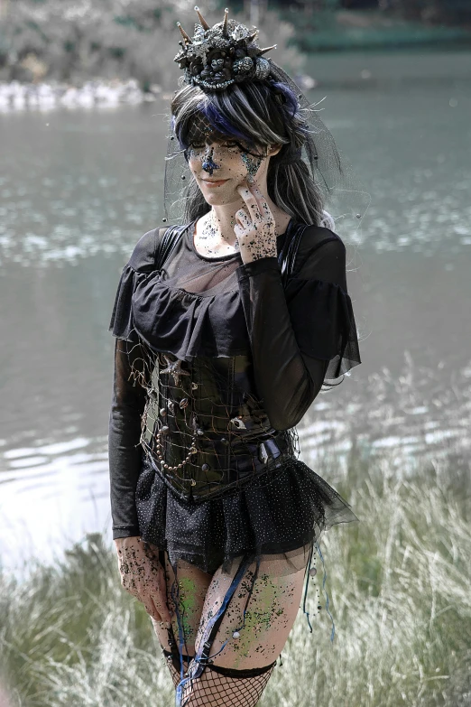 a woman standing next to a body of water, inspired by Luis Royo, gothic art, wearing an eye patch, taken in the early 2020s, slide show, intricate outfit