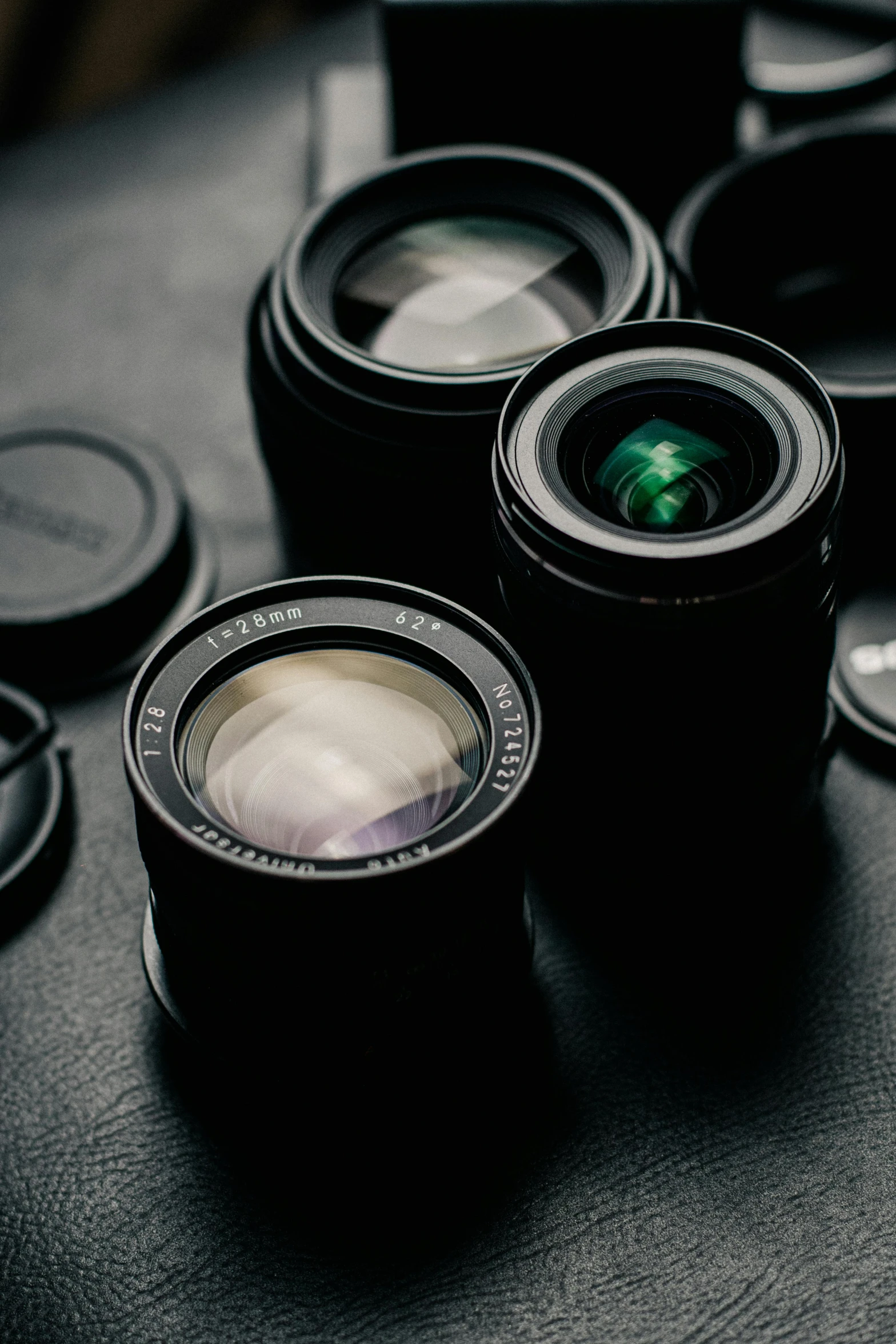 a bunch of camera lenses sitting on top of a table, a picture, pexels contest winner, aperture f12, close - up photograph, fujifilm”, soft lens