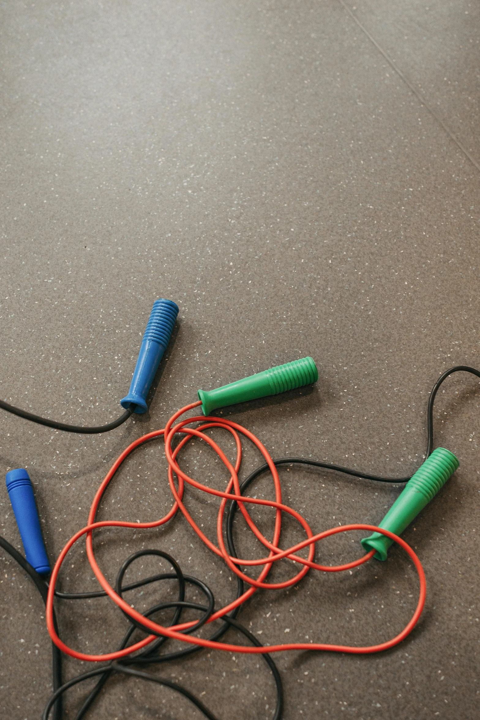 a bunch of wires that are on the ground, by Jesper Knudsen, lie detector test, rubber, background image, childhood